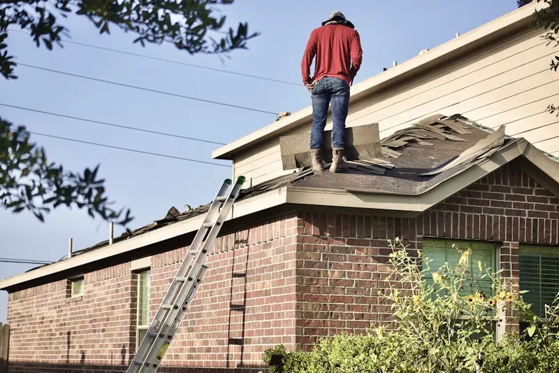 Professional roofer working on a residential roof in Championsgate Village